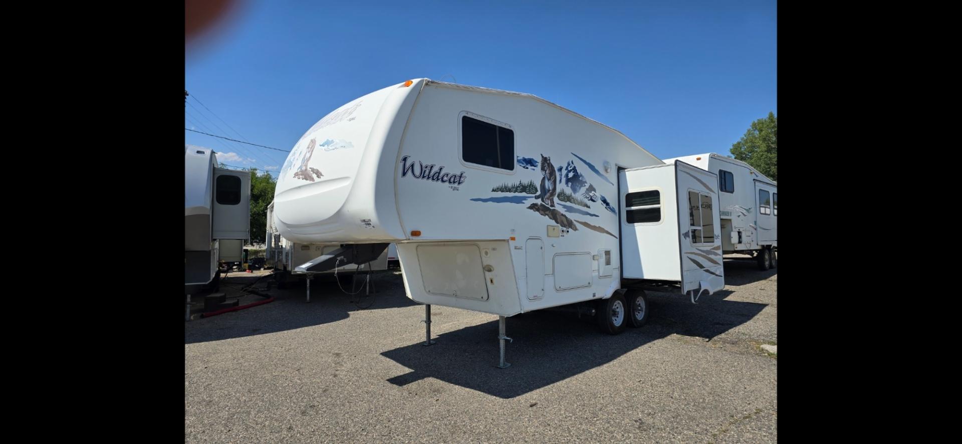 2007 White Forest River Wildcat , located at 923 US HWY 87 E., Billings, MT, 59101, (406) 245-0456, 45.795788, -108.451881 - This is a very nice 25' fifth wheel with 1 slide, Front queen walk around bed, Rear living room, Rear boat hitch With lights, Booth dinette and couch both make into beds, Could sleep 6, Immaculate!! A/C, Hot water, Furnace. Model 24RL. Dry weight. 6730 lbs. John at 4062080659. - Photo#1