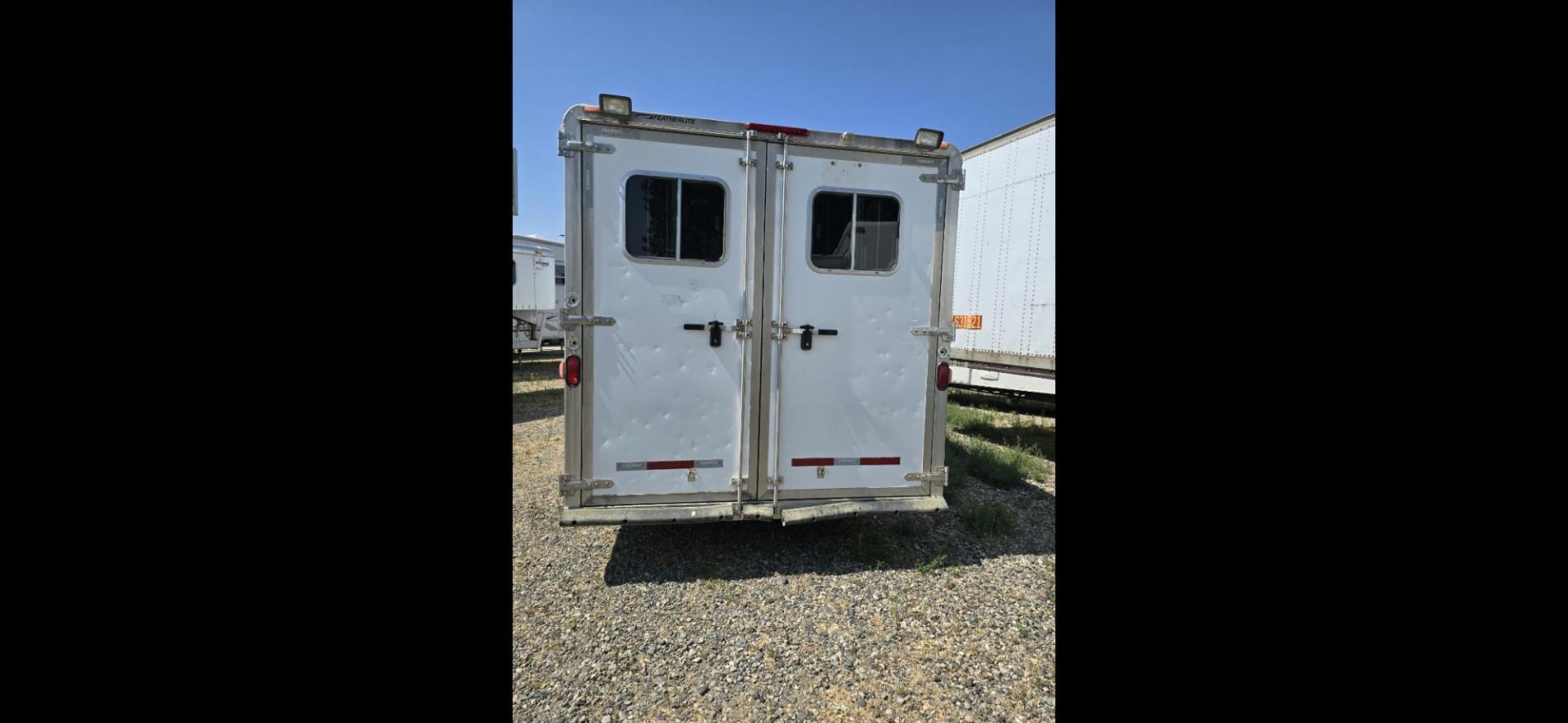 2007 White Feather Lite 3 Horse LQ , located at 923 US HWY 87 E., Billings, MT, 59101, (406) 245-0456, 45.795788, -108.451881 - 1 owner, very nice three horse Living quarters or Toy Hauler, Aluminum on aluminum, tires with less than 5000 miles.Never had a Horse in it, Purchased to use with four wheelers and side by sides, Back is insulated, no slants, Full bath shower toilet, Front queen bed, Couch makes into bed, Could slee - Photo#0