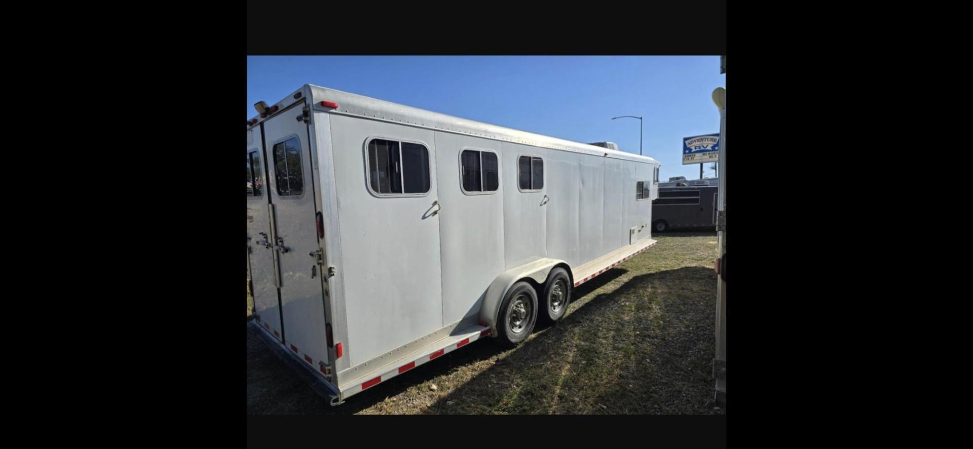 2003 White Sooner 3 Horse LQ , located at 923 US HWY 87 E., Billings, MT, 59101, (406) 245-0456, 45.795788, -108.451881 - Very nice three horse slant, 36' overall length, 7' short wall, Aluminum on aluminum, A/C, Forced air heat, Huge 6' midtack with sink, Rear three horse saddle rack, Tires at 80 percent, Front queen bed, couch makes into a bed, Full bath shower toilet, Light hail. John at 4062080659 - Photo#2