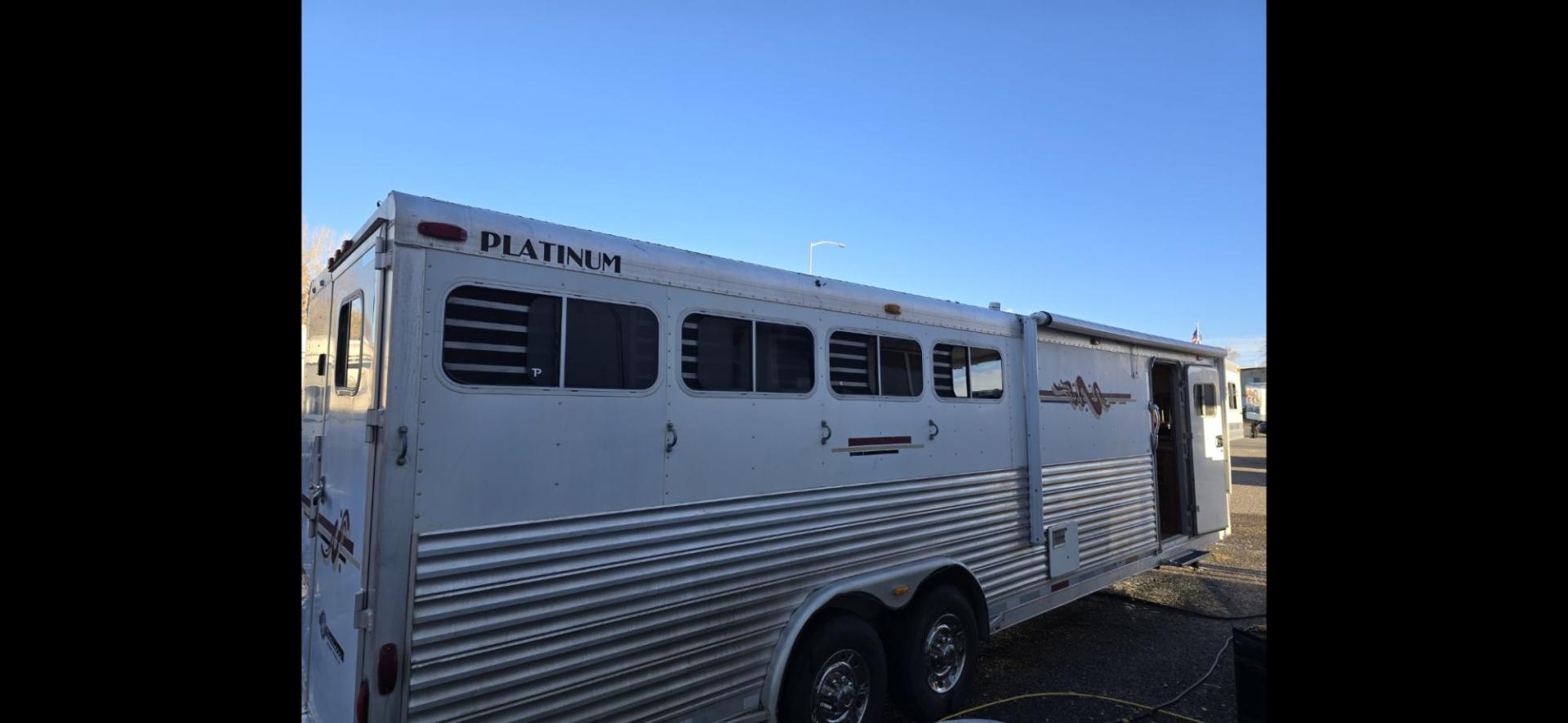 2005 Silver Platinum 4 horse LQ , located at 923 US HWY 87 E., Billings, MT, 59101, (406) 245-0456, 45.795788, -108.451881 - 2005 Platinum Four horse with LQ READY TO RODEO!!!! Fabulous shape and located in Billings MT. 4 horse with 12' LQ, front queen bed, rear double bunks. Walk through door, mangers, huge side tack with fold out pad rack. Aluminum on aluminum. Wired and plumbed for generator.15 gallon fuel tank. Flo - Photo#3